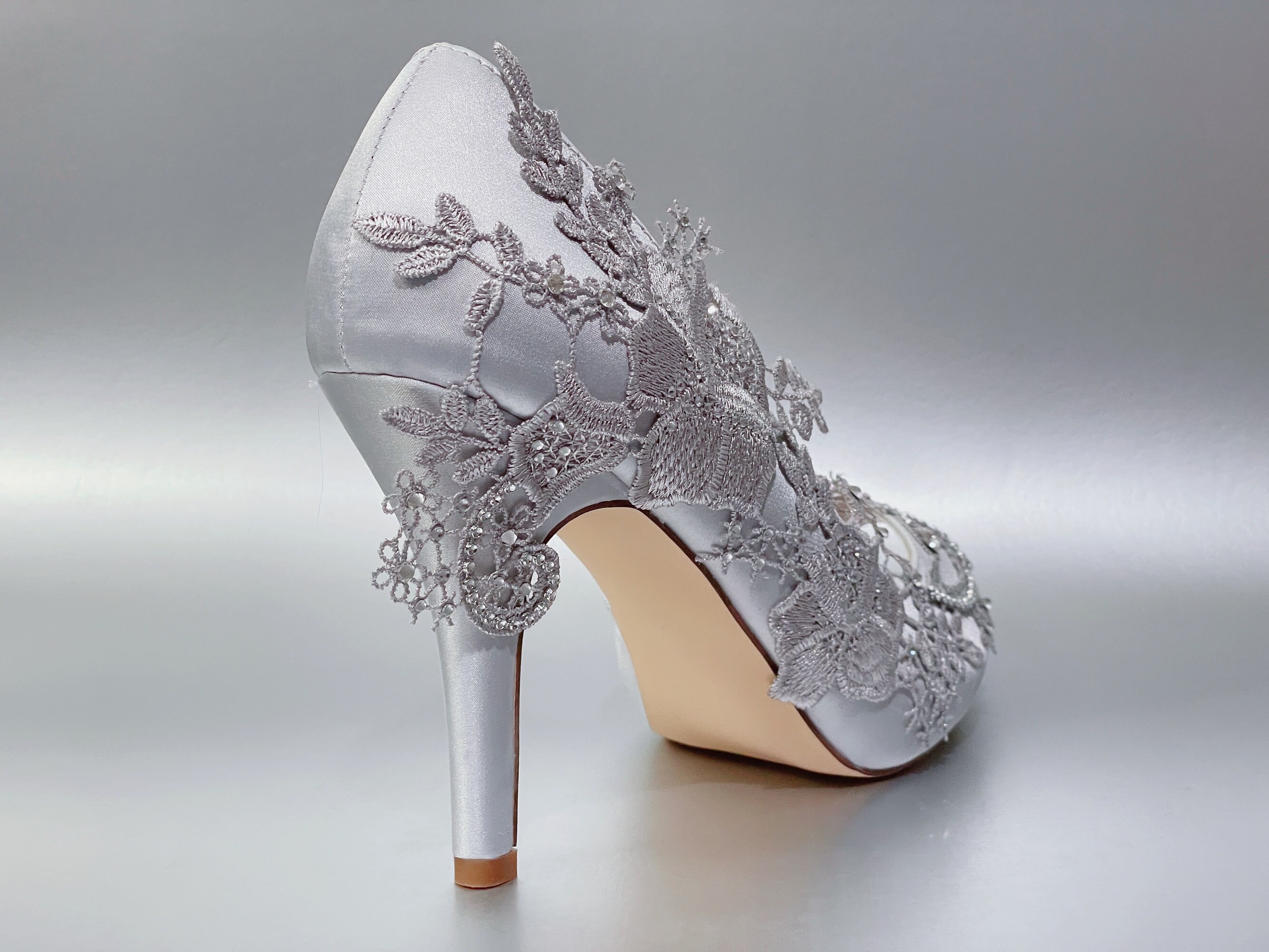 silver shoes for wedding dress RIBONGZ Women's Bow Heels Sparkly Closed Toe Strappy High Heels Sexy Rhinestone Ankle Strap Pumps Bridal Party Shoes 6.5 Matching clutch bag available Bride puts on her silver
