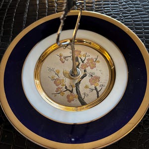Beautiful plate using the Art of Chokin on blue porcelain