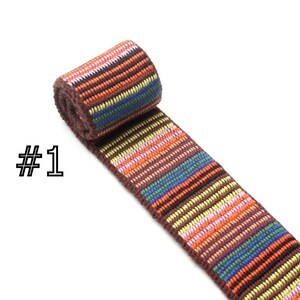 May include: Multicolored striped woven trim with brown, orange, yellow, pink, blue, and green stripes. #1