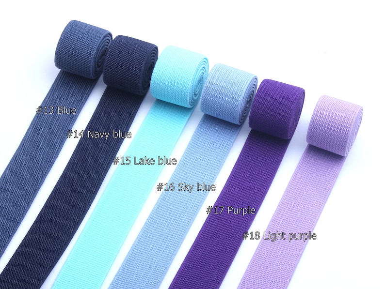 May include: Eight rolls of elastic webbing in various shades of blue and purple. The colors are labeled #13 Blue, #14 Navy blue, #15 Lake blue, #16 Sky blue, #17 Purple, and #18 Light purple.