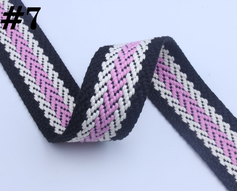 May include: Black, white, and pink woven cotton webbing with a chevron pattern. #7