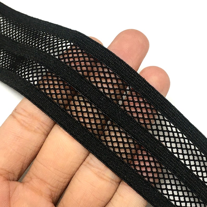May include: Black elastic trim with three rows of black mesh. The mesh is a diamond pattern.