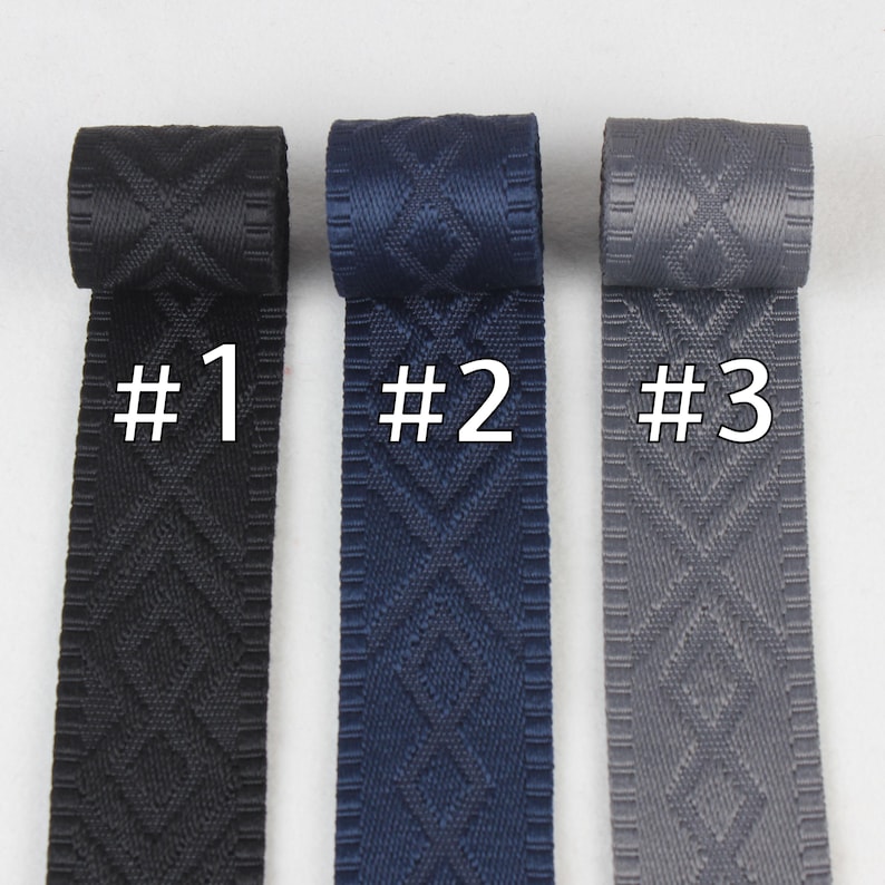 May include: Three rolls of woven webbing in black, navy blue, and gray. Each roll has a diamond pattern and is labeled with a number: #1, #2, and #3.