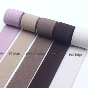 May include: Five spools of ribbon in different colors: dark pink, khaki, light coffee, coffee, and beige. The ribbon is labeled with numbers 6 through 10.