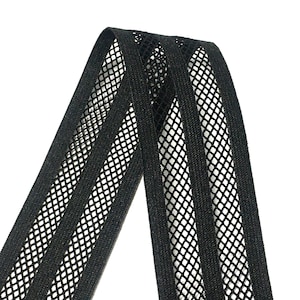 May include: Black elastic trim with a mesh design. The trim has three rows of mesh, creating a striped pattern.