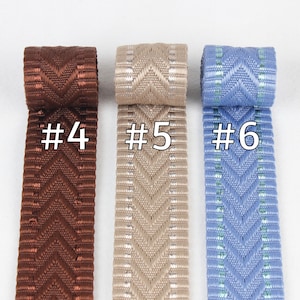 May include: Three samples of woven ribbon with a chevron pattern. The ribbon is brown, beige, and blue. The ribbon is labeled #4, #5, and #6.