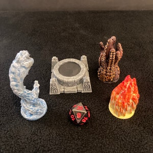 May include: A set of five 3D printed miniature figurines, including a gray stone platform, a blue water elemental, a red fire elemental, a brown tentacle monster, and a black and red 20-sided die.
