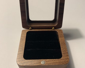 Elegant ring box made of walnut wood for a wedding