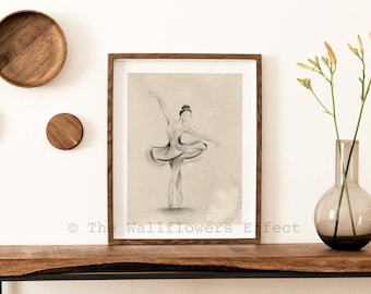May include: A framed charcoal-style drawing of a ballerina in a dance pose, centered within a dark wood frame. The artwork features a beige background with subtle white speckles and the text The Wallflowers Effect at the bottom.