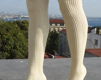 May include: A pair of white ribbed knee-high socks. The socks are made of a soft, comfortable material and have a classic look.