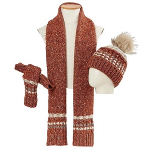 May include: A brown knit scarf with white accents, a matching brown knit hat with a white pom pom, and a pair of brown knit gloves.