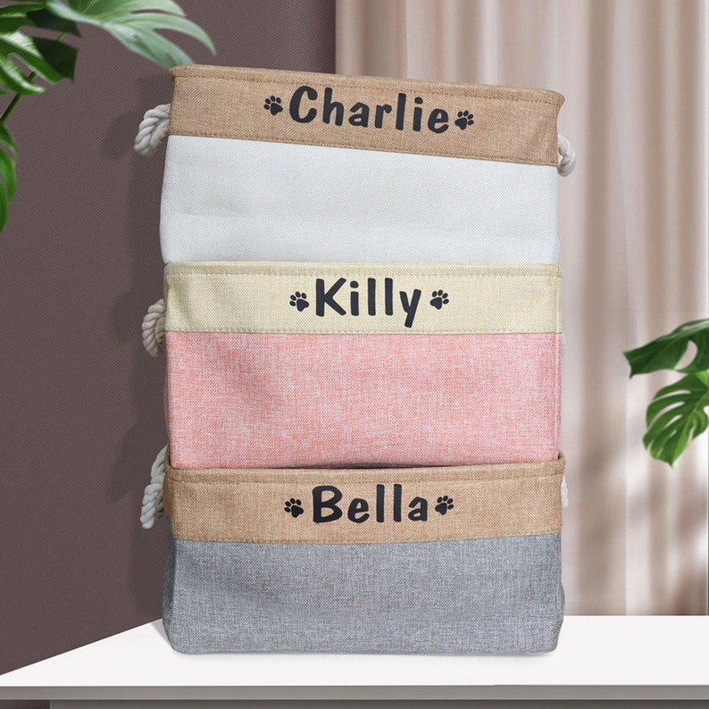 Custom pet organizer with a 100% polyester exterior and cotton interior, available in bone and paw designs. Lightweight, foldable, and easy to clean.