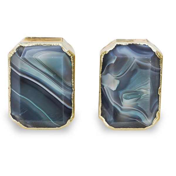 May include: A pair of gold-rimmed earrings with a blue and white agate stone design.