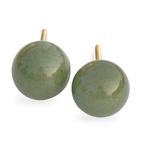 May include: A pair of green jade stone earrings with gold posts. The earrings are round and have a smooth, polished finish.