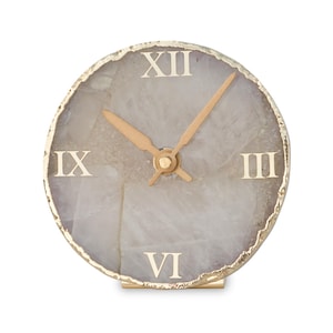 Reloj redondo de cuarzo rosa compuesto