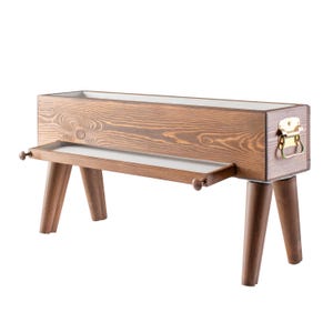 May include: A wooden planter box with a pull-out drawer and four legs. The planter is brown with a natural wood grain finish. The drawer is white and has a brass handle.