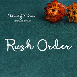 May include: A teal green background with the text "Eternity Stories Handmade Jewelry" and the text "Rush Order" in white cursive font.