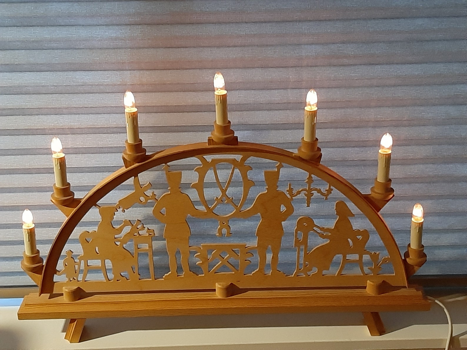 Classic electric candle arch Christmas lights. German Christmas light arch from the Erzgebirge. Wooden menorah. Carved wood. 110 volts.