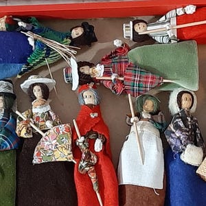 Set of 10 artisan vintage clothespin dolls Made in Wales, U.K. Detailed features and fashions Excellent vintage condition Wooden peg dolls