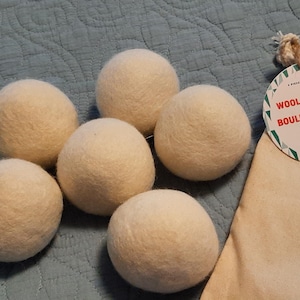 6 Wool dryer balls. 100% wool  Ivory color  Alternative to liquid fabric softener reduces wrinkles Reusable Eco friendly Anti static