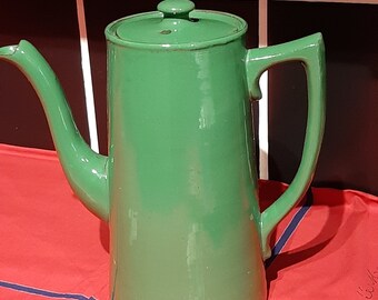 Large Fiestaware persimmon high gloss disc pitcher. 64 oz. Excellent condition. Simple beautiful lines. 7.5 inched tall. Ceramic pitcher.