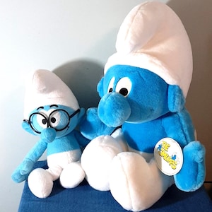 2 vintage Smurf plush toys Brainy Smurf and a 20 &quot; Smurf with original tag [ unidentified] Like new condition Huggably soft and cute
