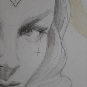 Portrait of a woman. Original pencil sketch by Canadian artist Alex Black. Bordered by a vintage oval frame.
