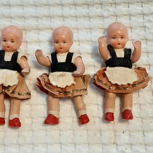 Set of 3 vintage bisque porcelain baby dolls with 2 detached wigs and hats Original clothes  all in a vintage wood box [not shown]