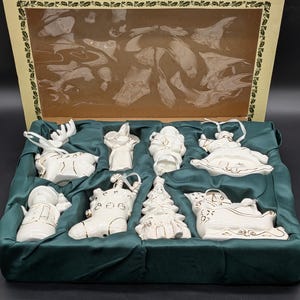 Vintage porcelain Christmas ornaments with gold trim accents. Made by International Bazaar. in original box.
