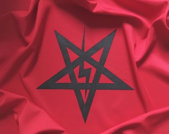 May include: A black pentagram with a lightning bolt inside, printed on a red fabric background.