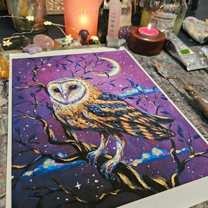 May include: A painting of a barn owl perched on a branch with a crescent moon in the background. The owl is depicted in shades of brown, white, and gold, with a purple sky filled with stars. The painting has a whimsical and magical feel.