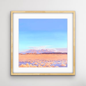 May include: A framed print of a desert landscape with a mountain range in the distance. The sky is a light blue with a few clouds. The foreground is a field of dry, brown grass.
