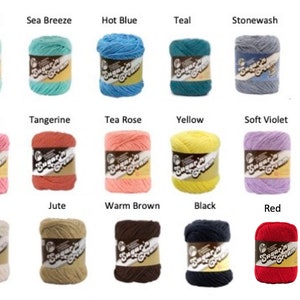 May include: A collection of seventeen Sugar'n Cream yarn skeins in various colors including Beach Glass, Sea Breeze, Hot Blue, Teal, Stonewash, Hot Pink, Rose Pink, Tangerine, Tea Rose, Yellow, Soft Violet, White, Ecru, Jute, Warm Brown, Black, and Red.