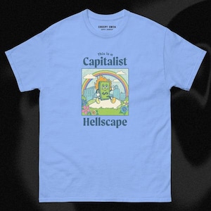 これは資本主義の地獄だ | 半袖ユニセックスTシャツ | ブラックユーモアTシャツ