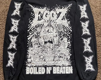 May include: Black long-sleeve t-shirt with a white graphic print of a cartoon monster with the text "BOILED N' BEATEN" and the word "DECAY" repeated on the sleeves.