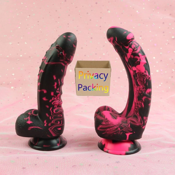 Black Dildo With A Pink Head