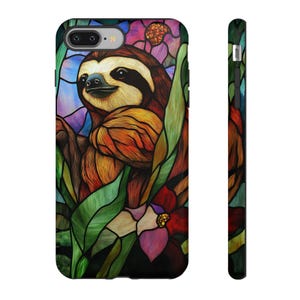 May include: A stained glass style phone case featuring a sloth with orange, brown, and green foliage. The sloth is surrounded by colorful flowers.