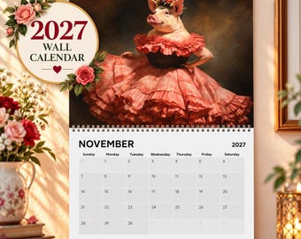 Op de afbeelding: Een wandkalender voor 2027 met een varken dat een bloemenkrans en een rode jurk met ruches draagt. De kalenderpagina toont de maand november 2027 met een datumsraster. De tekst 2027 WALL CALENDAR staat op een ronde badge met rozen.