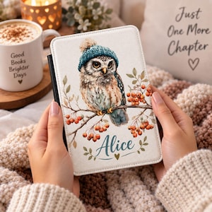 May include: A rectangular e-reader cover with a white background featuring an illustration of a brown owl wearing a teal knit hat. The owl is perched on a branch with orange berries. The name Alice is printed in teal script below the owl.