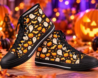 May include: A pair of black high-top sneakers featuring a repeating pattern of orange jack-o'-lanterns, white ghosts, and small brown bats. The shoes have black laces, black rubber toe caps, and a thick black sole with a thin white stripe detail.