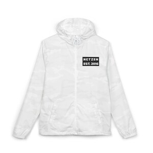 May include: White camouflage-patterned jacket with a hood and a zipper closure. A black rectangular patch on the chest displays the text "NCTZEN EST. 2016" in white. The jacket is lightweight and appears to be made of a water-resistant material.