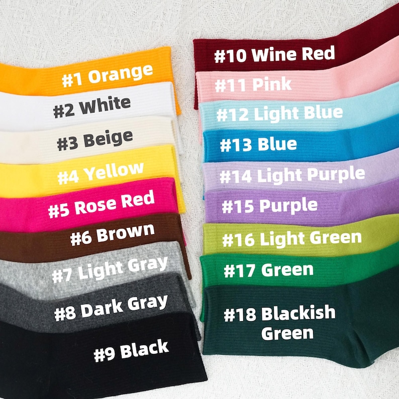 May include: A collection of colorful socks, each labeled with a number and color name. Colors include orange, white, beige, yellow, rose red, brown, light gray, dark gray, black, wine red, pink, light blue, blue, light purple, purple, light green, green, and blackish green.
