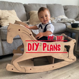 May include: A child sits on a wooden rocking horse, which is painted brown. The rocking horse is in a living room with a couch and a coffee table. The text "DIY PLANS" is printed in red on the rocking horse.