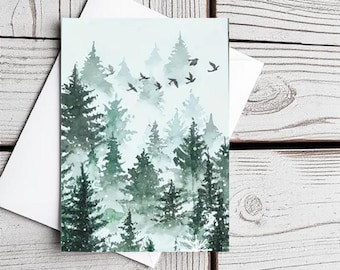 Biglietti di auguri con pini, uccelli e cielo acquerellati