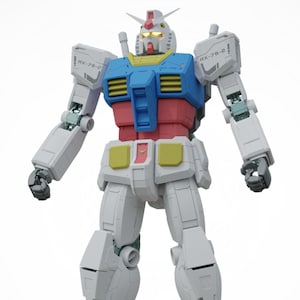 May include: A detailed model of a Gundam robot, primarily white with blue, red, and yellow accents. The robot has a detailed head with a prominent antenna and is standing upright with its arms at its sides. The model is a collectible item.