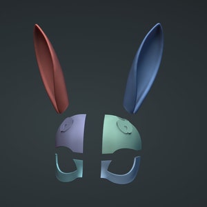 May include: A blue, red and green bunny mask with a split design. The mask has two ears, one blue and one red, and a face with two eyes and a nose.
