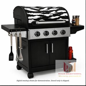 May include: A black and silver gas grill with a zebra print lid. The grill has four control knobs, a side shelf, and a lower cabinet. Includes grilling utensils and accessories.