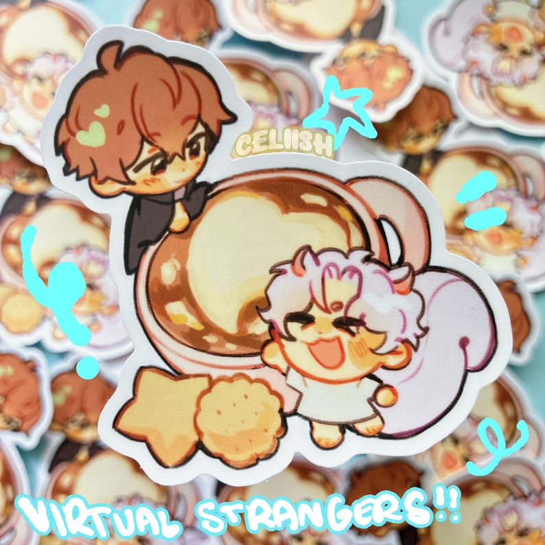 May include: A sticker featuring two cartoon characters, one with brown hair and the other with pink hair, near a cup of coffee and two cookies. The sticker has the text "CELIISH" and "VIRTUAL STRANGERS!!".