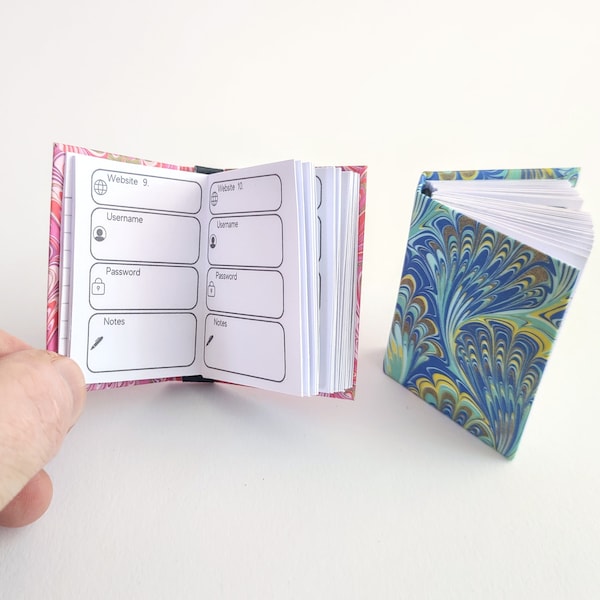 Miniature Password Organiser Book. Functioning handmade tiny journal to keep internet login details safe. Hardback cover, various colours.
