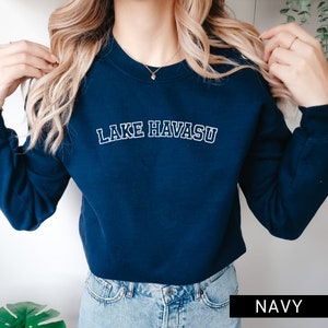 May include: Navy blue sweatshirt with white text that reads "LAKE HAVASU" in a collegiate font.